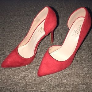 Red suede pumps